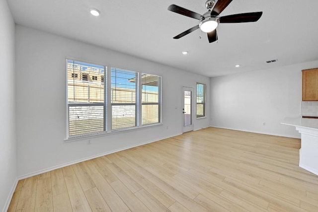 8004 Tranquil Glade Trl, Austin, TX 78744 - unfurnished living room with a ceiling fan, light wood-type flooring, baseboards, and recessed lighting