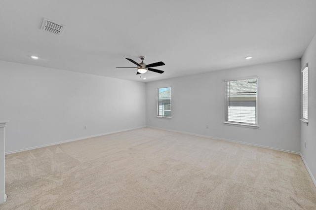 8004 Tranquil Glade Trl, Austin, TX 78744 - spare room with light carpet, recessed lighting, baseboards, and a ceiling fan