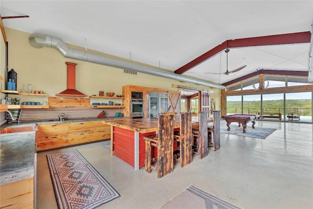176 Elk Rdg, Canyon Lake, TX 78133 - kitchen featuring open shelves, ventilation hood, built in appliances, pool table, and vaulted ceiling