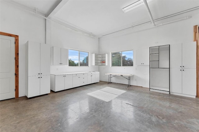 176 Elk Rdg, Canyon Lake, TX 78133 - interior space featuring a high ceiling and finished concrete flooring