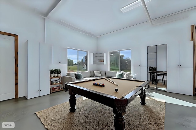 176 Elk Rdg, Canyon Lake, TX 78133 - rec room with a healthy amount of sunlight, pool table, concrete flooring, and a towering ceiling