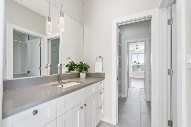 bathroom featuring tile patterned flooring and vanity