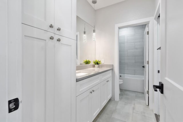 full bathroom with toilet and vanity