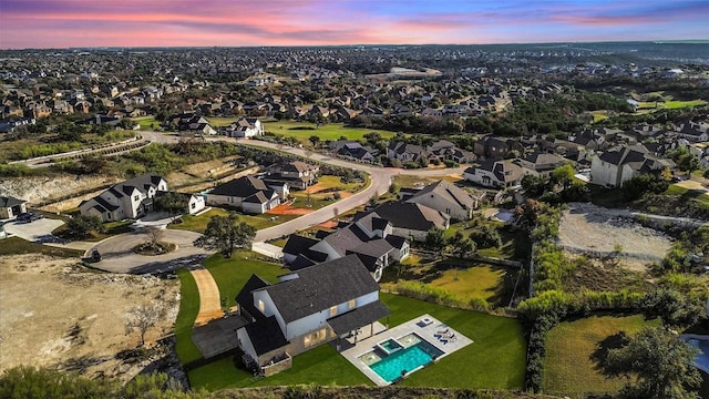 aerial view at dusk with a residential view