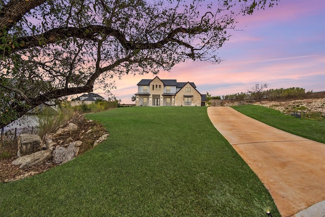 view of front of property with a lawn