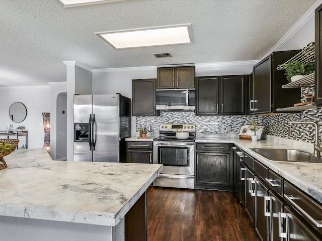 kitchen with dark hardwood / wood-style flooring, sink, tasteful backsplash, and stainless steel appliances