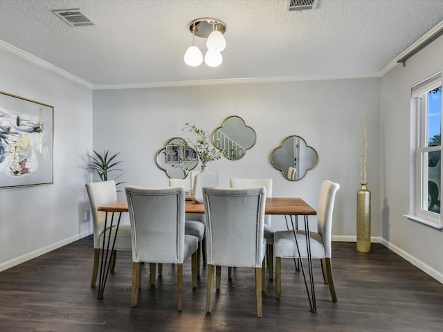 dining area featuring ornamental molding, dark hardwood / wood-style floors, and a textured ceiling