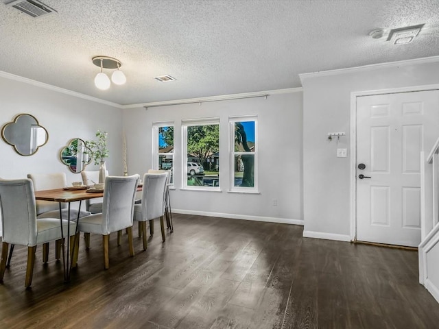 dining room with ornamental molding, dark hardwood / wood-style floors, and a textured ceiling