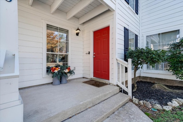 doorway to property featuring covered porch