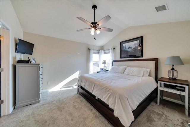 carpeted bedroom featuring ceiling fan and vaulted ceiling