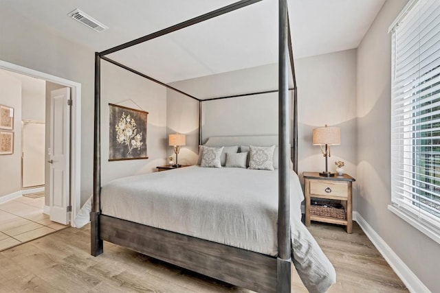 bedroom with light hardwood / wood-style floors