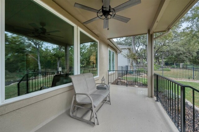 sunroom featuring ceiling fan and a healthy amount of sunlight