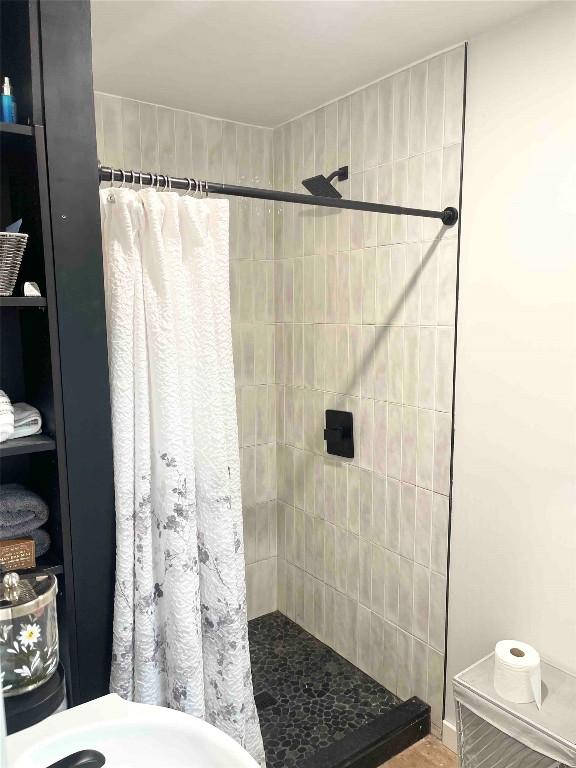 bathroom with a shower with curtain