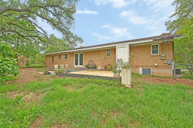 4505 Dudley Dr, Austin, TX 78735 - back of house featuring brick siding, french doors, and a patio area