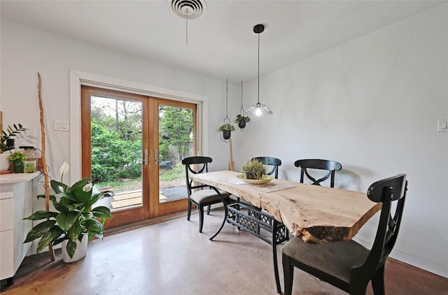 4505 Dudley Dr, Austin, TX 78735 - dining room with french doors and concrete floors