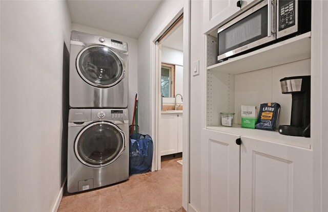 4505 Dudley Dr, Austin, TX 78735 - laundry room featuring stacked washer and clothes dryer and a sink