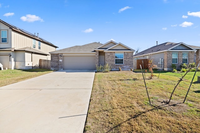 single story home featuring a garage and a front lawn