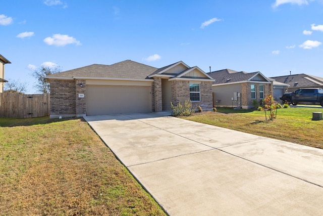 ranch-style house featuring a front yard and a garage