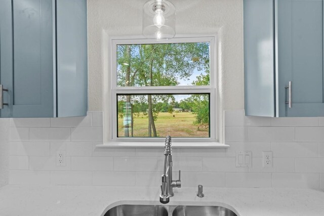 408 Griffin St, Luling, TX 78648 - kitchen view of light stone counters and tasteful backsplash