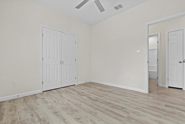 408 Griffin St, Luling, TX 78648 - unfurnished bedroom featuring wood finished floors, a ceiling fan, and a closet