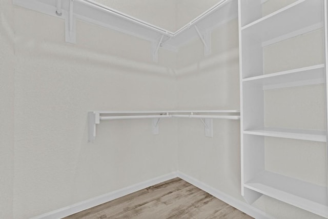 408 Griffin St, Luling, TX 78648 - walk in closet featuring wood finished floors
