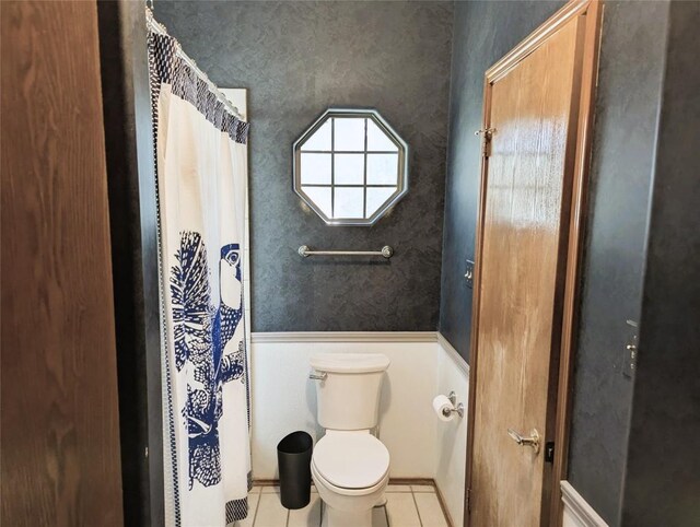 bathroom featuring tile patterned floors and toilet