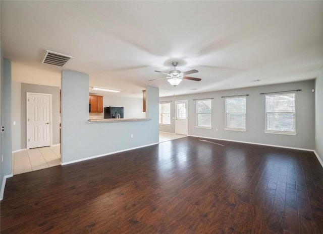 unfurnished living room with ceiling fan and light wood-type flooring