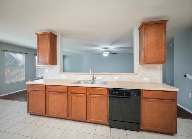 kitchen with ceiling fan, dishwasher, sink, backsplash, and light tile patterned floors