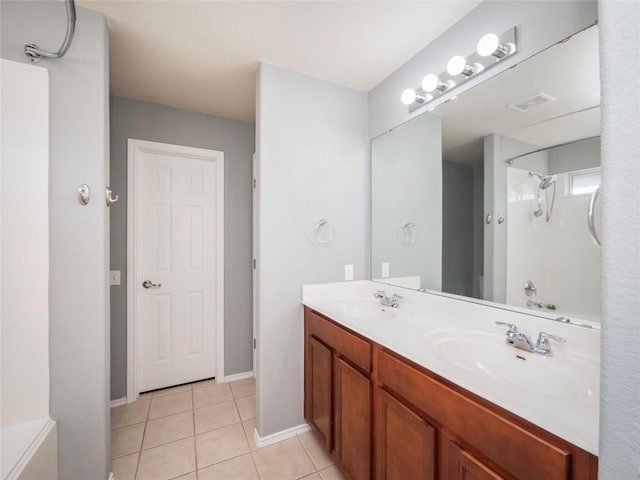 bathroom featuring tile patterned flooring, vanity, and shower / bath combination