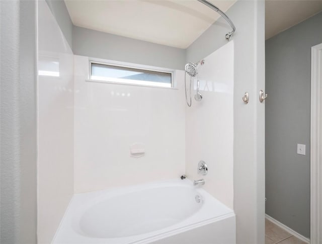 bathroom featuring tile patterned floors and shower / washtub combination