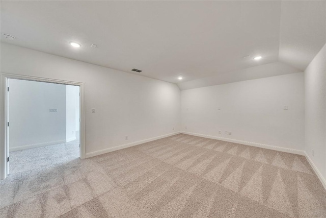 2204 Bayridge Rd, Georgetown, TX 78628 - empty room with light colored carpet, recessed lighting, baseboards, and vaulted ceiling
