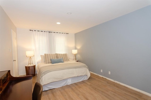 bedroom with wood-type flooring