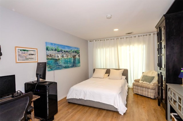 bedroom featuring light wood-type flooring