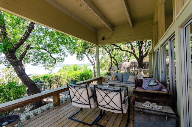 wooden terrace featuring an outdoor hangout area