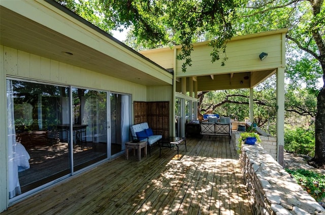 wooden terrace with outdoor lounge area