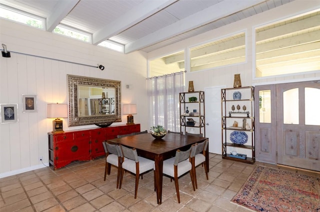 dining area with beam ceiling