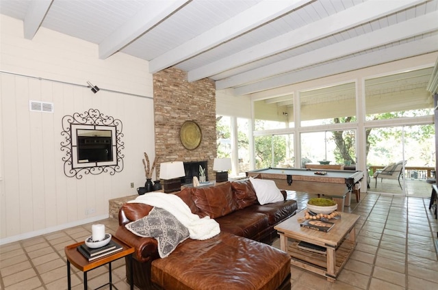 living room with wood walls, tile patterned flooring, a fireplace, pool table, and beamed ceiling