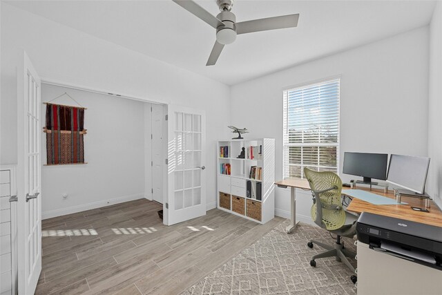 office space with light hardwood / wood-style flooring, french doors, and ceiling fan