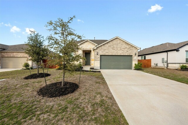 view of front of property with a garage and a front yard