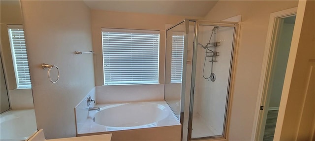 bathroom with separate shower and tub and lofted ceiling