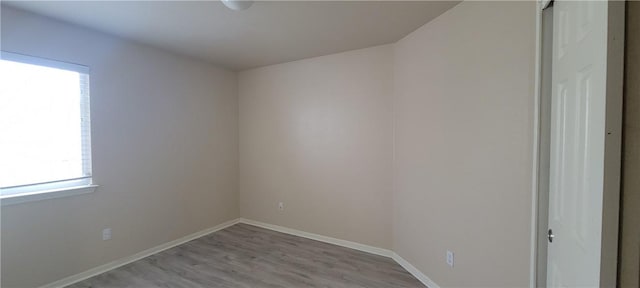 spare room featuring light wood-type flooring