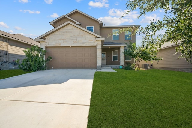 view of front of home featuring a garage, central air condition unit, and a front lawn