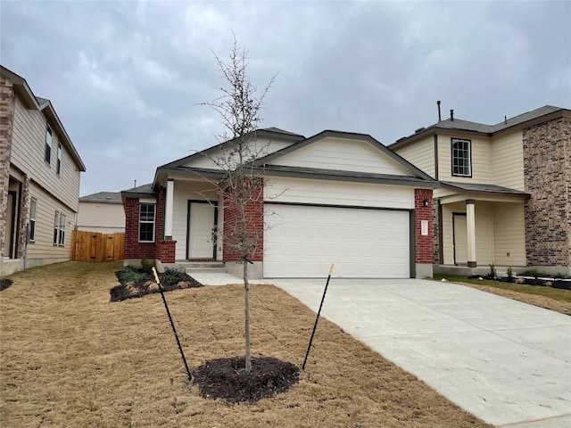 view of front of property featuring a garage and a front yard