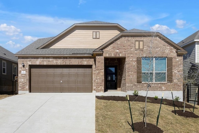 view of front facade featuring concrete driveway, an attached garage, brick siding, and a shingled roof