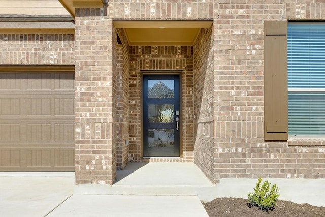 entrance to property with brick siding