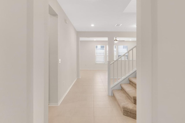 interior space featuring visible vents, recessed lighting, stairway, light tile patterned flooring, and baseboards