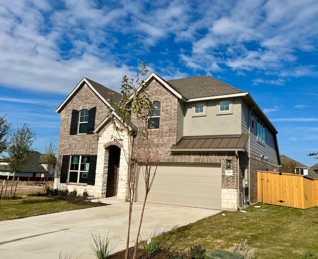 view of front facade with a garage and a front lawn