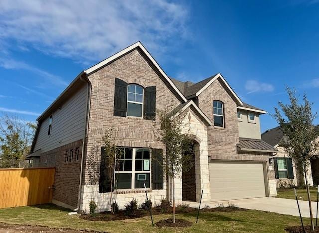 view of front of house with a garage and a front yard