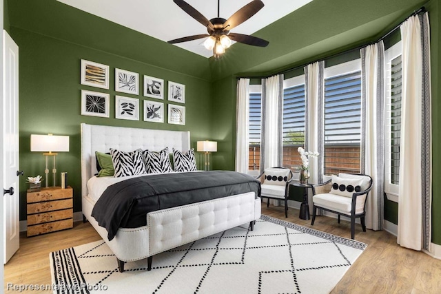 bedroom with ceiling fan and light wood-type flooring