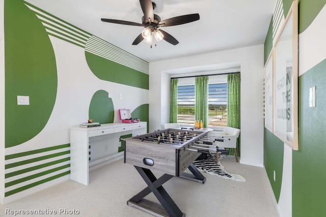 playroom with light colored carpet and ceiling fan